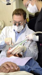 A dental implant procedure being performed in a dental office