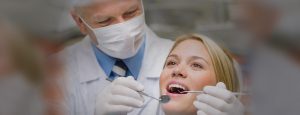 A person smiling with snap-in dentures and a treatment plan