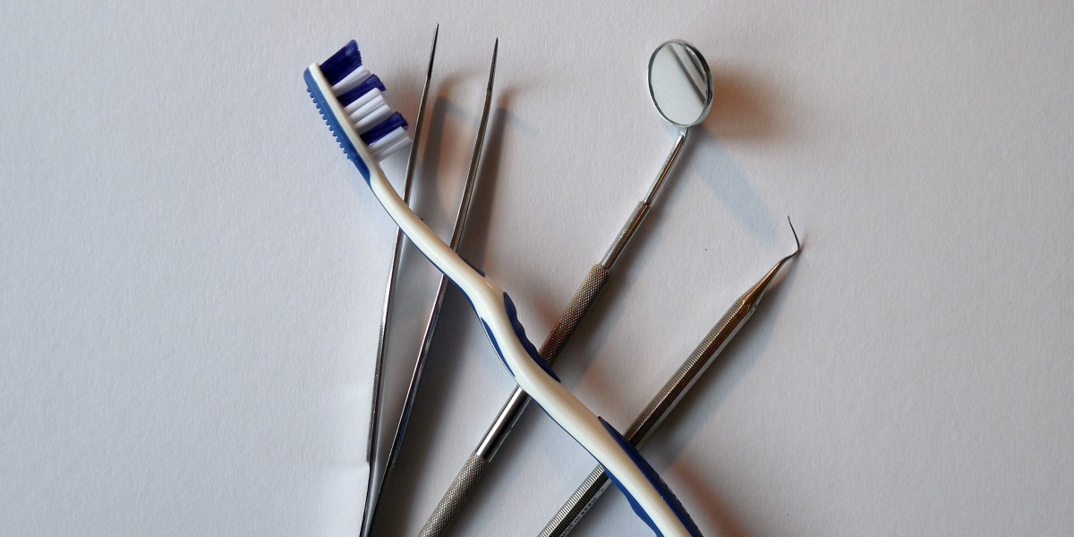 toothbrush and dentist tools - 6 Important Tips for Caring for Your New Dentures