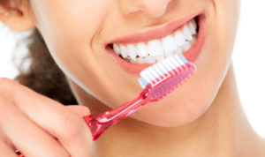 do you have to brush dental implants