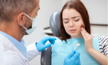 Woman with toothache at dentist