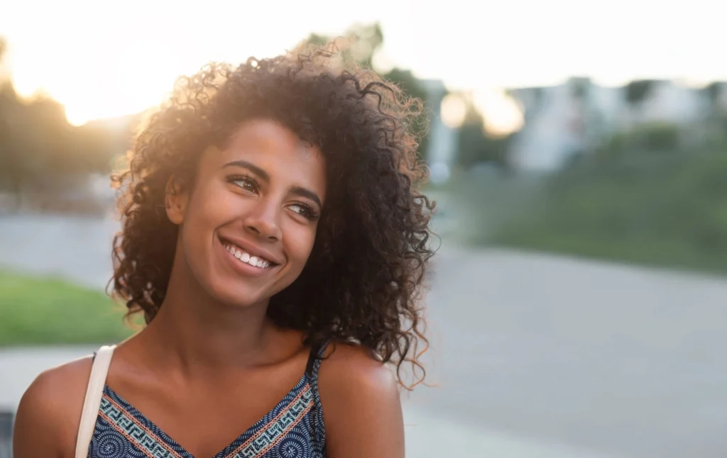 Girl smiling with her dental implants rockville md