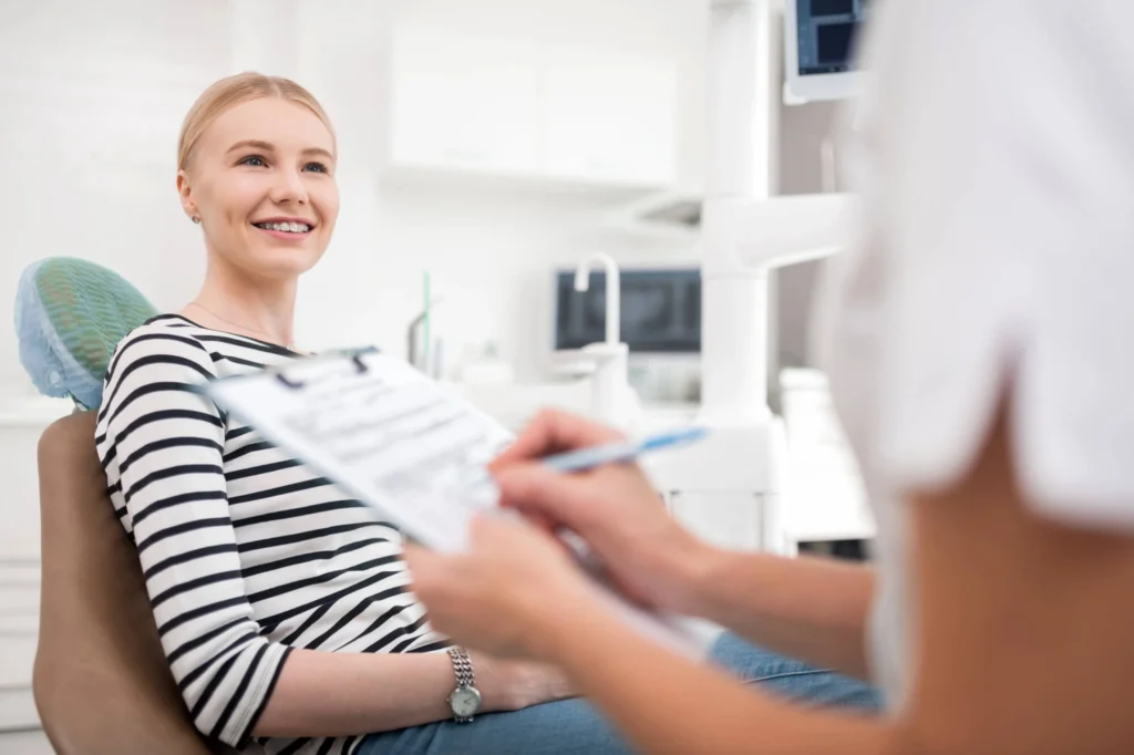 Woman happy in her follow up check up with Dentist Rockville MD