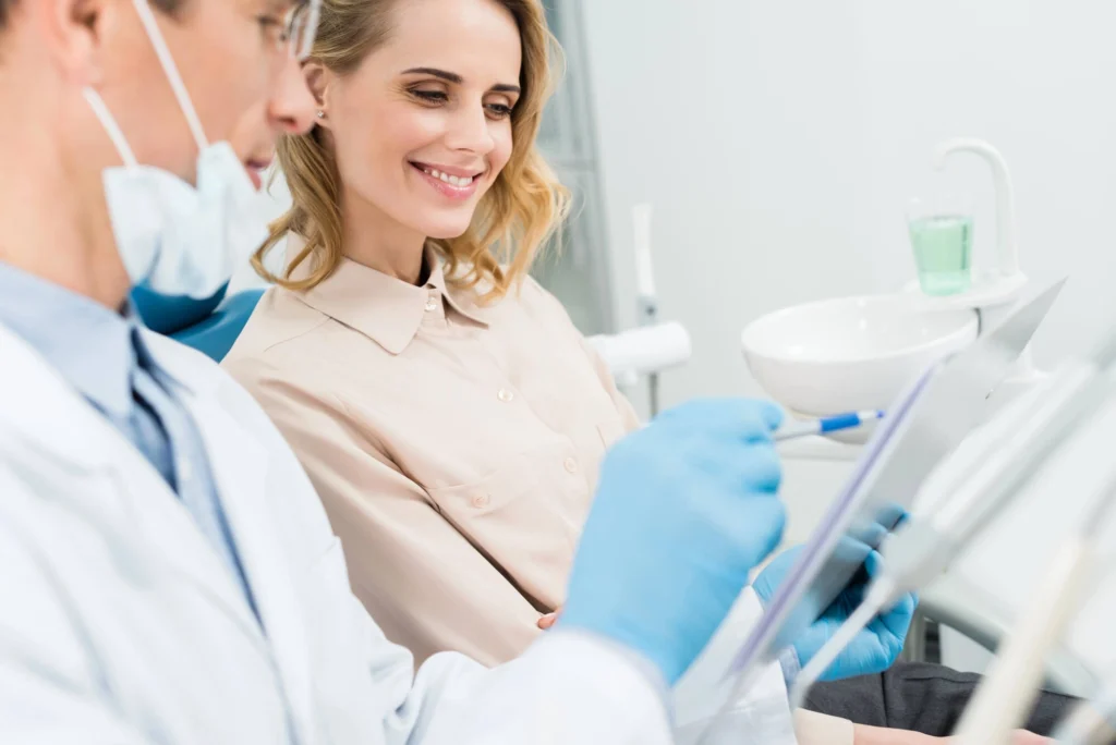 Girl discussing with dentist about cosmetic dentistry rockville md