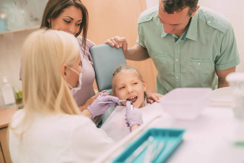 Kid checking her teeth family dentistry rockville md