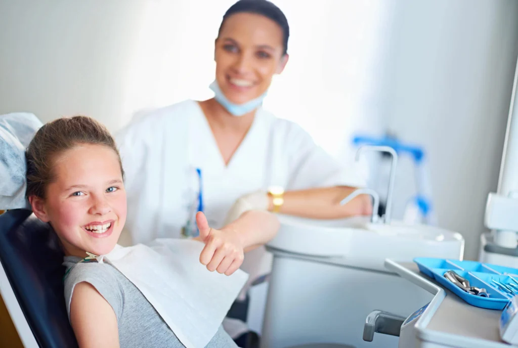 Girl smiling after emergency treatment by an emergency dentist rockville md