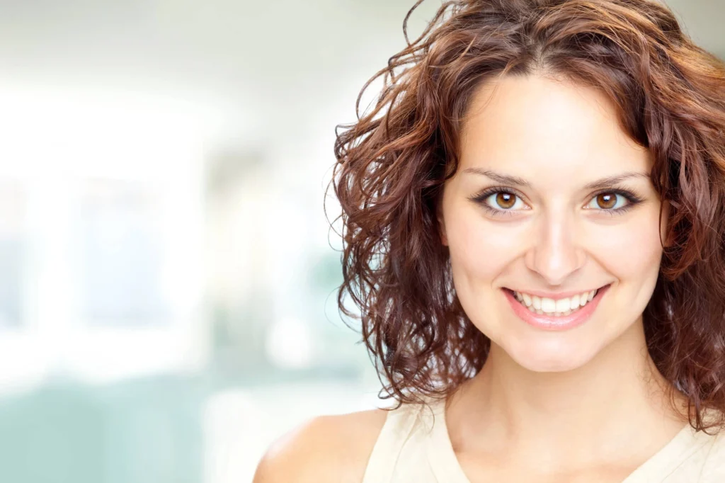 Girl with nice teeth after teeth whitening rockville md