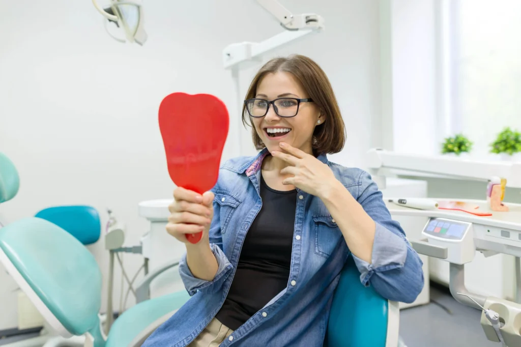 Woman smiling after dental implants rockville md