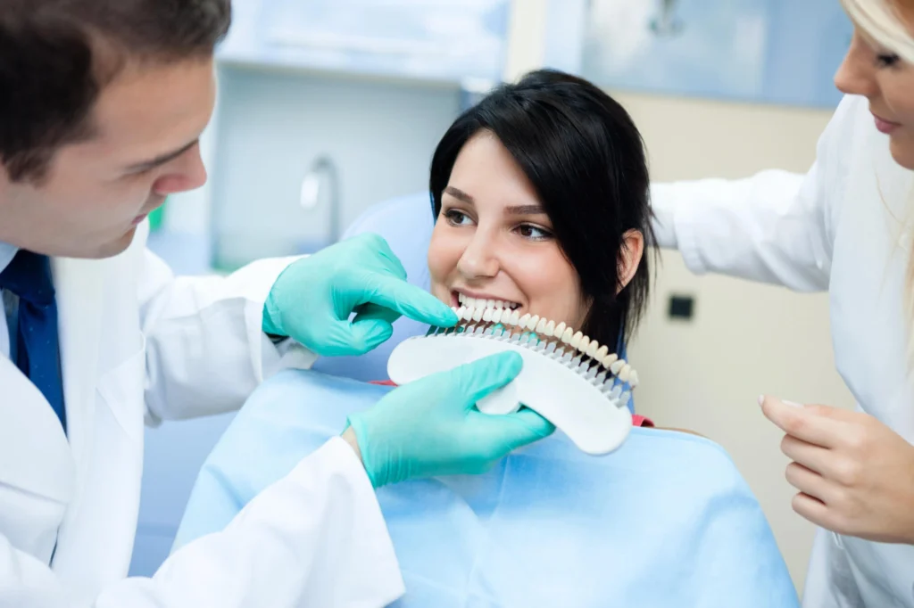 Woman checking teeth shade after teeth whitening in Rockville, MD
